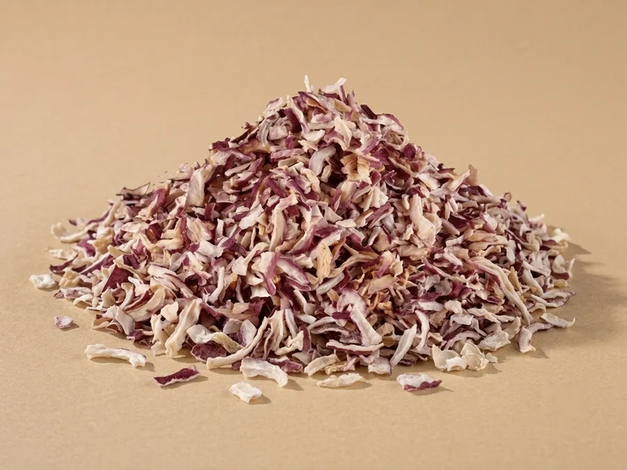 Dehydrated red onion, chopped grade, 3 to 5 mm chips of cream flesh flecked with burgundy skin.