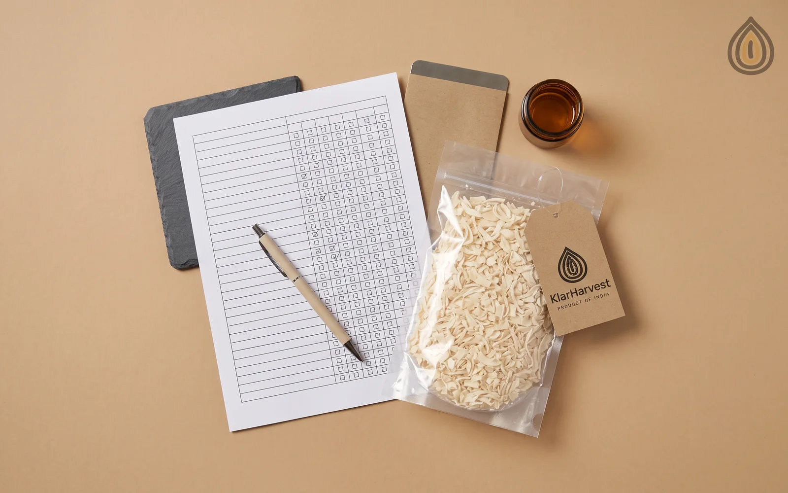 Printed allergen declaration form with tick boxes beside a sealed sample bag of dehydrated onion on a desk